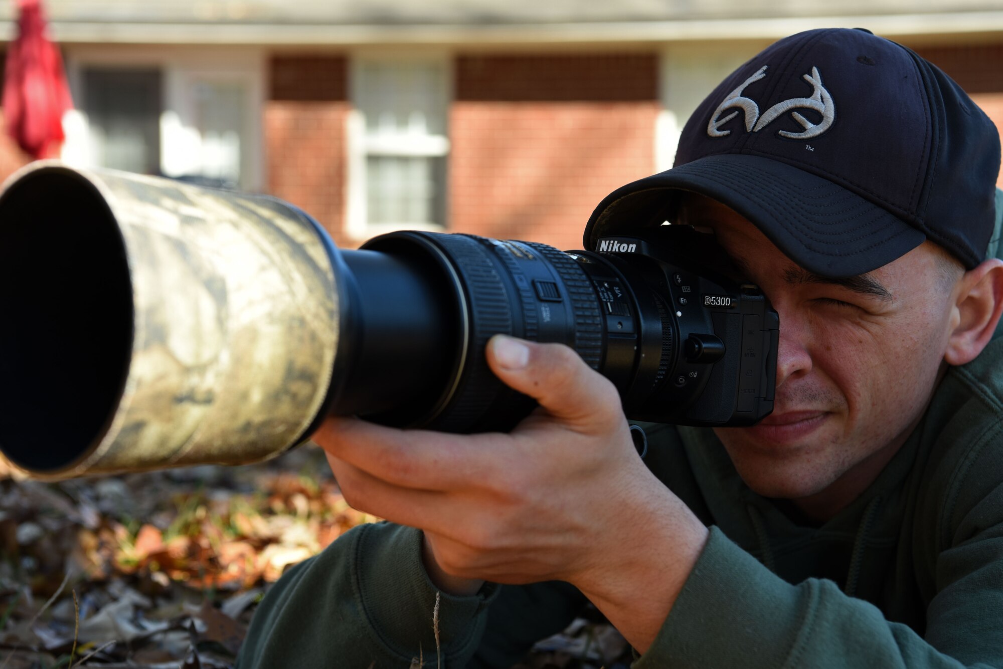 U.S. Air Force Airman 1st Class Noah Rachau, 20th Aircraft Maintenance Squadron crew chief, lays down to take a photo at his residence in Sumter, S.C., Dec. 22, 2018.