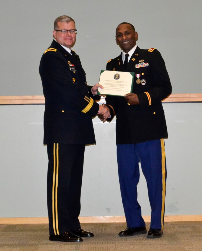 Army Lt. Col. Thomas E. Wooden Jr., right, receives his retirement certificate from DLA Troop Support Commander Army Brig. Gen. Mark T. Simerly during a retirement ceremony in Philadelphia Jan. 4, 2018.