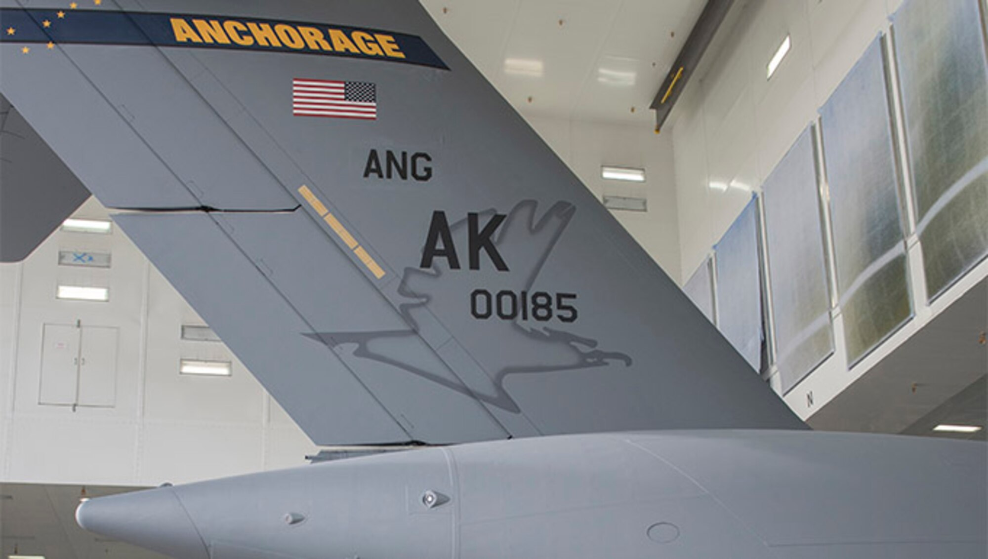 Members of the Alaska Air National Guard’s 176th Wing and the Regular Air Force’s 3rd Wing witnessed the unveiling of a new tail flash on the C-17 Globemaster IIIs assigned to the 176th Wing’s 144th Airlift Squadron at Joint Base Elmendorf-Richardson, Alaska, Oct. 1, 2018. The new tail flash depicts a wolf head, (the 144th AS’s emblem), on one side, and a firebird (the 517th AS’s emblem), of equal size on the other. (U.S. Air National Guard photo by Tech. Sgt. N. Alicia Halla