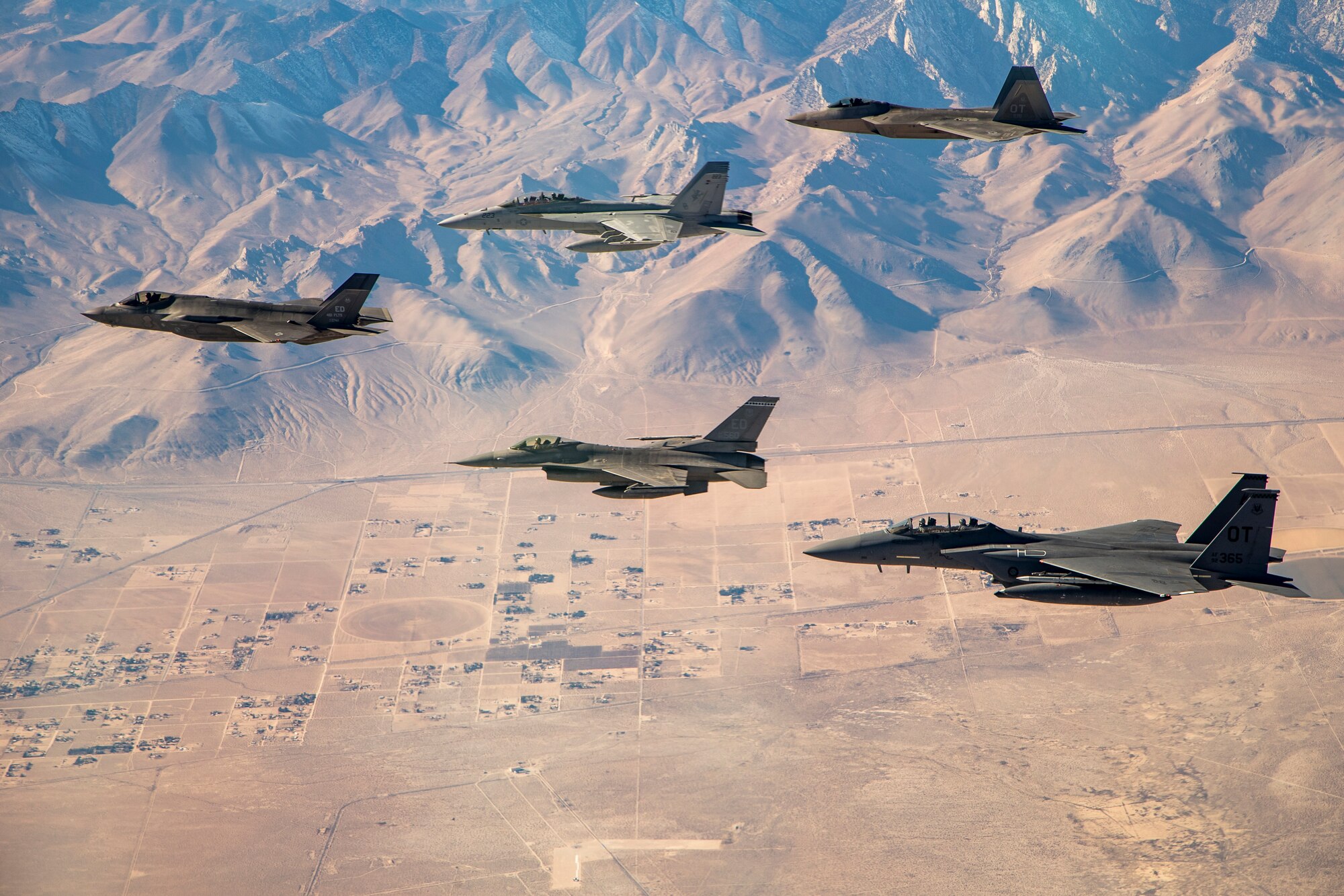 An F-35 and F-16 from Edwards Air Force Base are joined by an F-15E and F-22 from the 422nd Test and Evaluation Squadron out of Nellis Air Force Base, Nevada, along with a Navy F-18 from Air Test and Evaluation Squadron 31 out of Naval Air Weapons Station China Lake, California, Dec. 13, 2017, for an Orange Flag test exercise. (U.S. Air Force photo by Ethan Wagner)