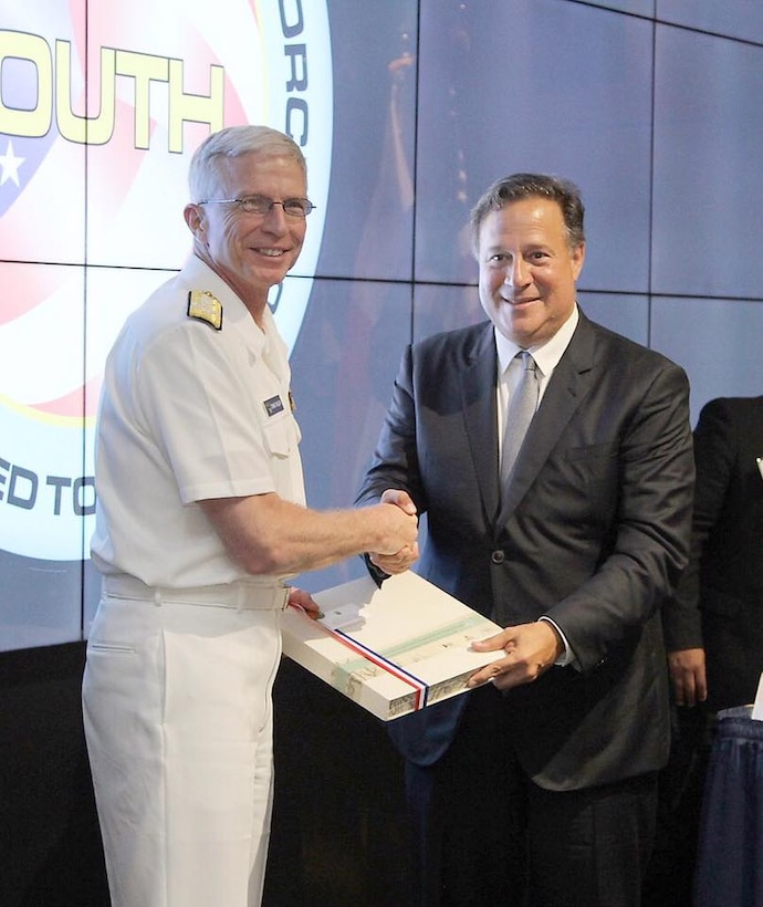 Panamanian President Juan Carlos Varela exchanges gifts with Navy Adm. Craig Faller, Commander of U.S. Southern Command.