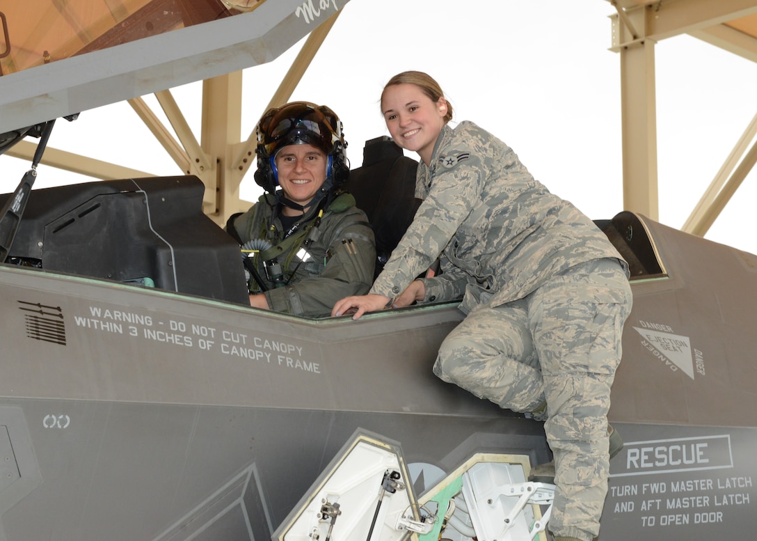 Maj. Rachael Winiecki, 461st Flight Test Squadron F-35 test pilot (left), and Airman 1st Class Heather Rice, 412th Aircraft Maintenance Squadron crew chief, pose for a photo right after Winiecki landed her F-35 Lightning II on her first test mission flight in the fifth-generation fighter Dec. 14, 2018. (U.S. Air Force photo by Kenji Thuloweit)