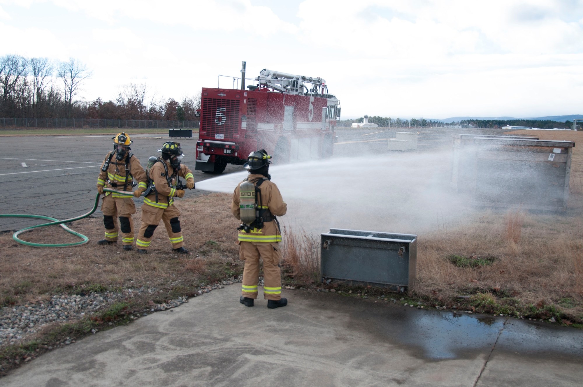104th Civil Engineering Squadron firefighters conduct live structural fire training Nov. 27, 2018, at Barnes Air National Guard Base, Massachusetts. The training ensures the Fire Attack Teams are prepared to respond to any fires on base or in the surrounding communities. (U.S. Air National Guard photo by Airman 1st Class Randy Burlingame)