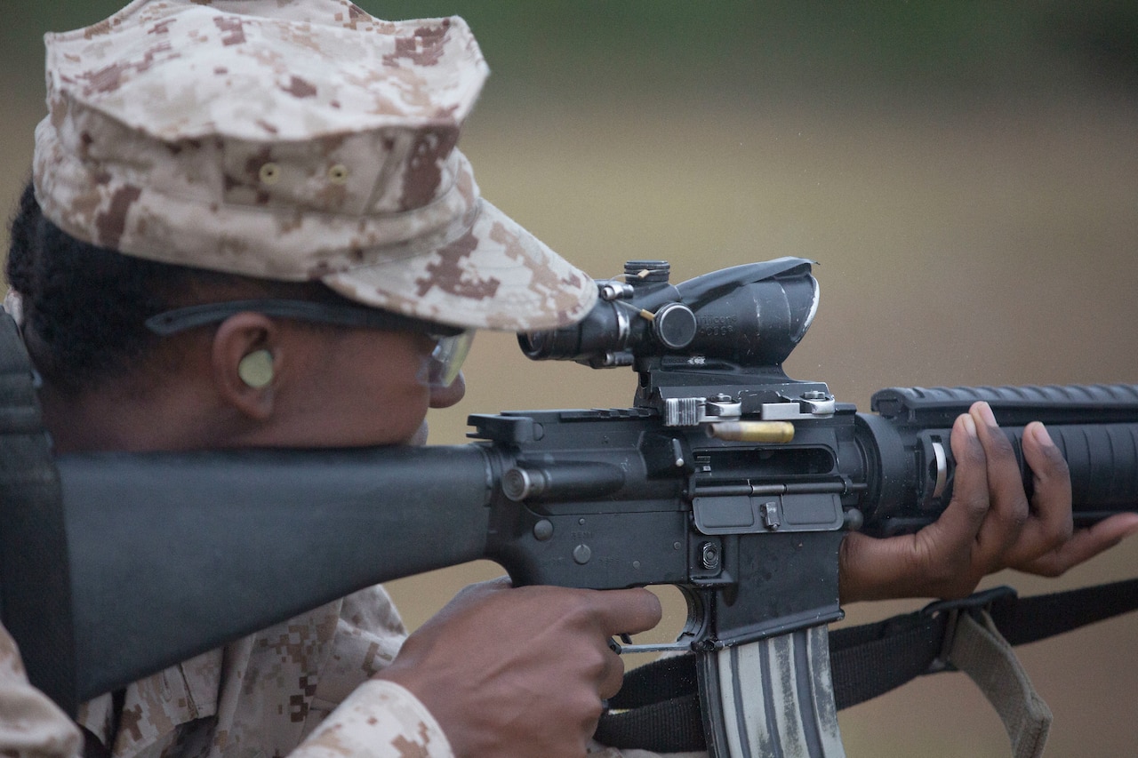 A Marine Corps recruit uses a weapons range.