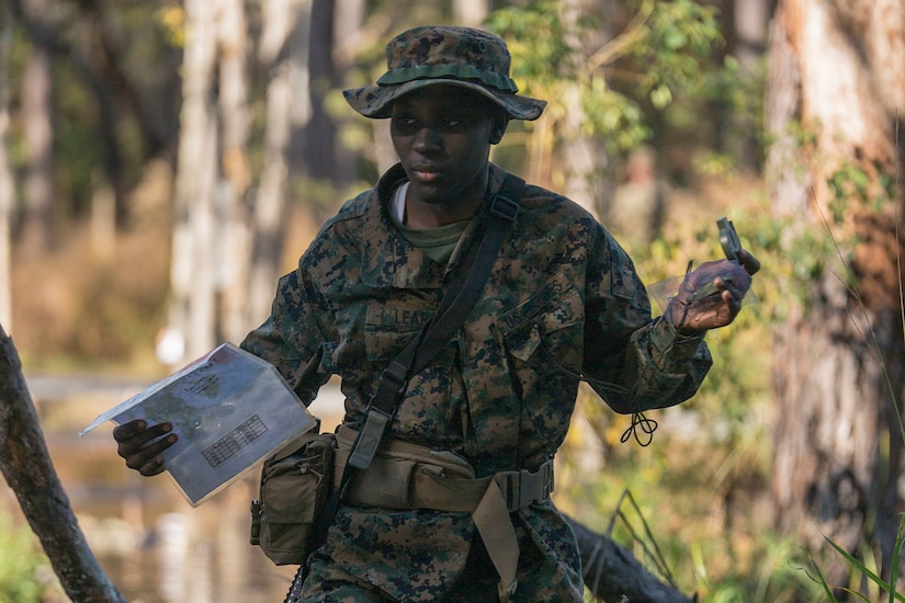 A Marine Corps recruit conducts land navigation.