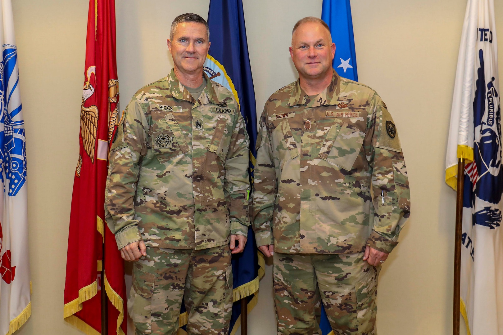 Army Command Sgt. Maj. Paul Biggs (left), Senior Enlisted Leader for Futures and Concepts Center, a subordinate organization of Army Futures Command in Austin, TX., poses for a photo with Air Force Chief Master Sgt. James Brown (right), Senior Enlisted Leader for Joint Task Force Civil Support (JTF-CS), at the JTF-CS headquarters at Fort Eustis. Futures and Concepts Center is located at Army Training and Doctrine Command, also headquartered at Fort Eustis and adjacent to JTF-CS. The visit was held to foster friendship and teamwork between the military neighbors. (Official DoD photo by Navy Petty Officer Third Class Michael Redd/released)