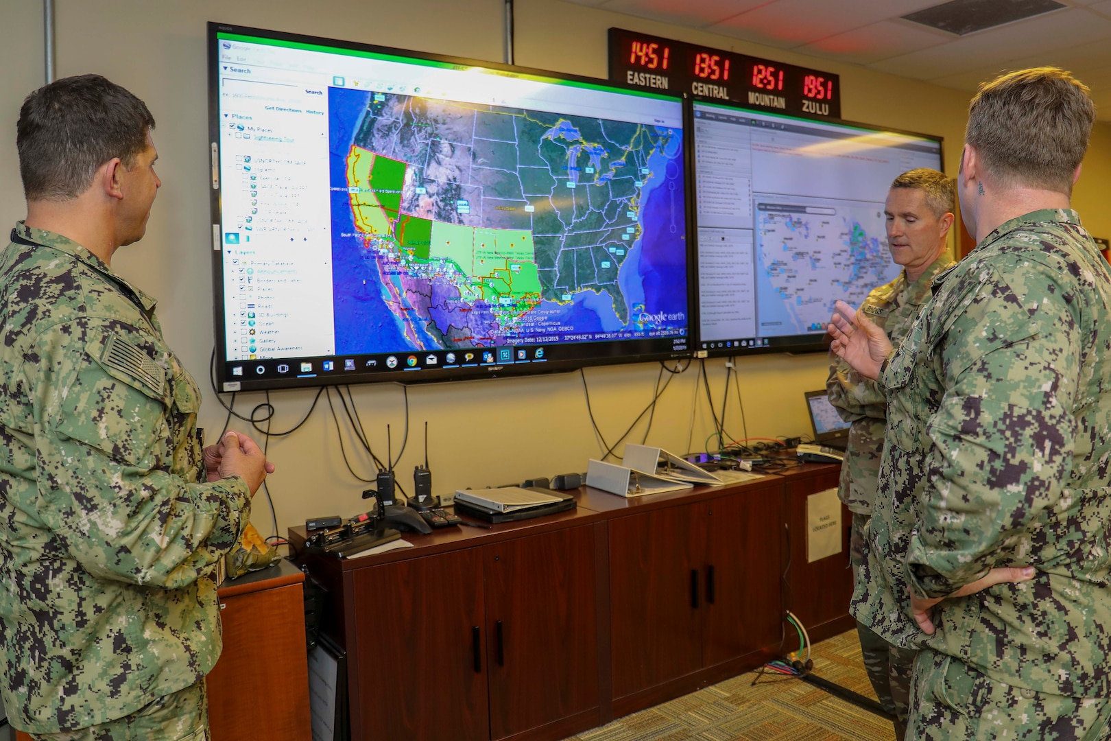 Army Command Sgt. Maj. Paul Biggs, Senior Enlisted Leader for Futures and Concepts Center, a subordinate organization of Army Futures Command in Austin, TX., is briefed by Navy Chief Damage Controlman Benjamin Allen on the Common Operational Picture (COP), a system that allows shared situational understanding between Joint Task Force Civil Support (JTF-CS) and partner organizations. Futures and Concepts Center is located at Army Training and Doctrine Command, also headquartered at Fort Eustis and adjacent to JTF-CS. The visit was held to foster friendship and teamwork between the military neighbors. (Official DoD photo by Navy Petty Officer Third Class Michael Redd/released)