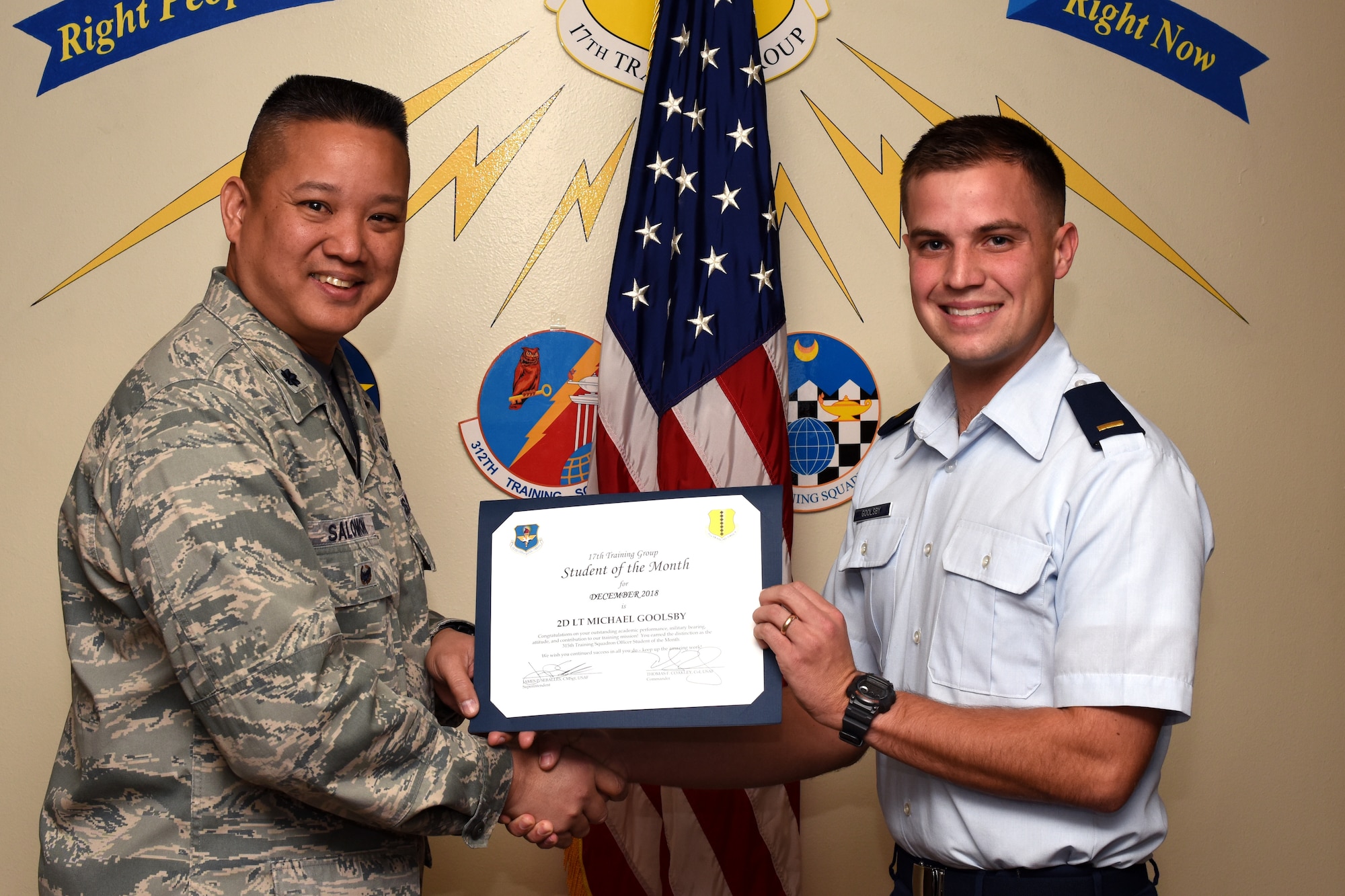 U.S. Air Force Col. Abraham Salomon, 17th Training Group deputy commander, presents the 315th Training Squadron Officer Student of the Month award to 2nd Lt. Michael Goolsby, 315th TRS student at Brandenburg Hall on Goodfellow Air Force Base, Texas, Jan. 4, 2019. The 315th TRS’s vision is to develop combat-ready intelligence, surveillance and reconnaissance professionals and promote an innovative squadron culture and identity unmatched across the U.S. Air Force. (U.S. Air Force photo by Airman 1st Class Zachary Chapman/Released)