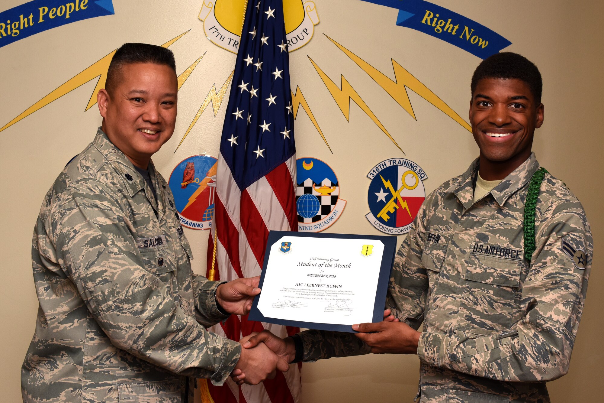 U.S. Air Force Col. Abraham Salomon, 17th Training Group deputy commander, presents the 315th Training Squadron Student of the Month award to Airman 1st Class Leernest Ruffin, 315th TRS student, at the Brandenburg Hall on Goodfellow Air Force Base, Texas, Jan. 4, 2019. The 315th TRS’s vision is to develop combat-ready intelligence, surveillance and reconnaissance professionals and promote an innovative squadron culture and identity unmatched across the U.S. Air Force. (U.S. Air Force photo by Airman 1st Class Zachary Chapman/Released)