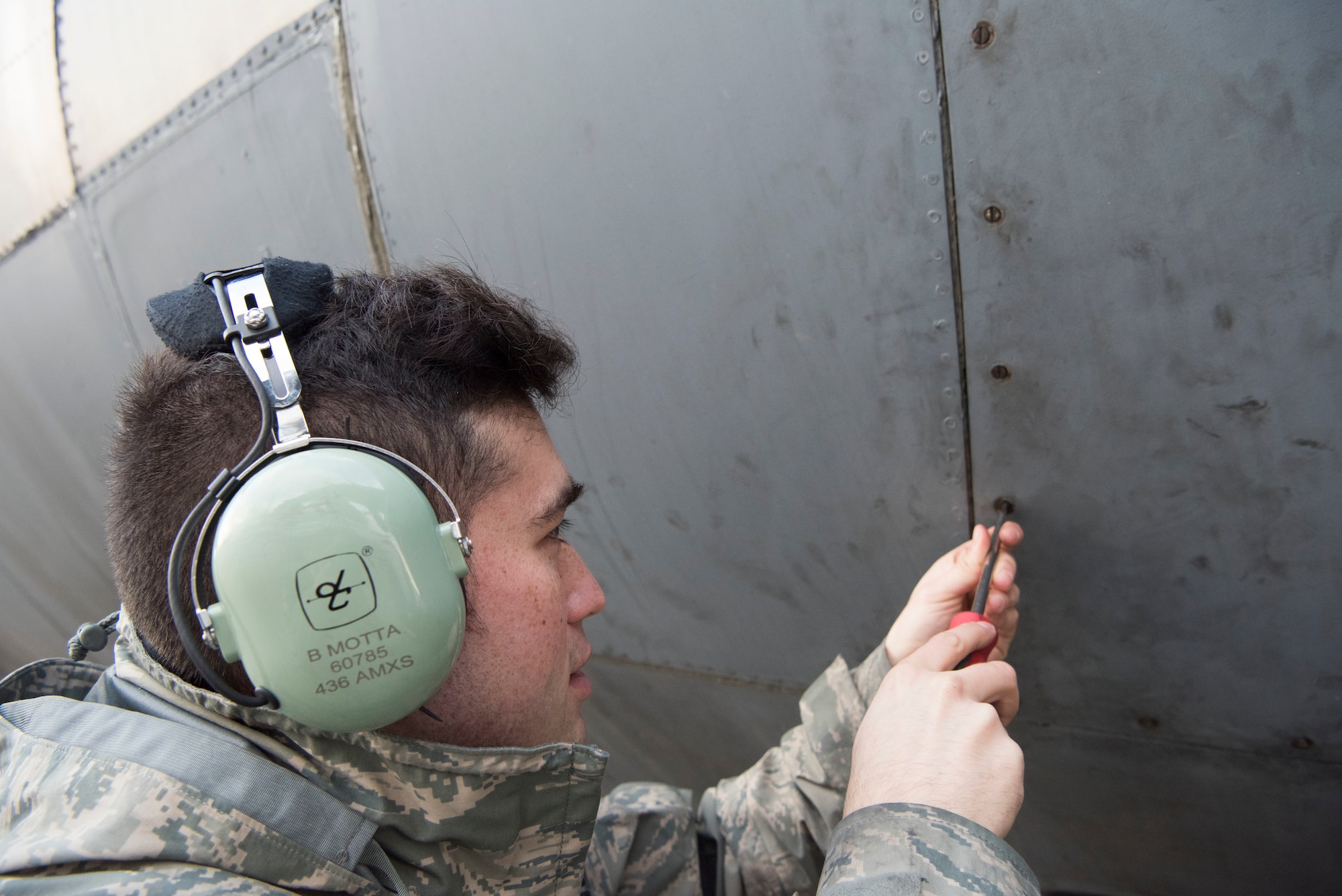 U.S. Air Force Staff Sgt. Brian Motta, 521st Air Mobility Operations Wing communications navigations journeyman, closes a door on a C-5M Super Galaxy aircraft after checking the auxiliary power unit oil Dec. 4, 2018, on Ramstein Air Base, Germany. This task was one of the approximately 1,000 tasks 141 students learned and trained on throughout the two week training exercise. (U.S. Air Force photo by Airman 1st Class Kristof J. Rixmann)