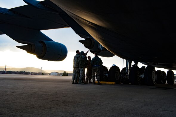 An Airman points to a strut within a C-5M Super Galaxy aircraft during a training session where students learned how to ensure a strut is fully serviceable Dec. 4, 2018, on Ramstein Air Base, Germany. This task was one of the approximately 1,000 tasks 141 students learned and trained on throughout a two week training exercise.