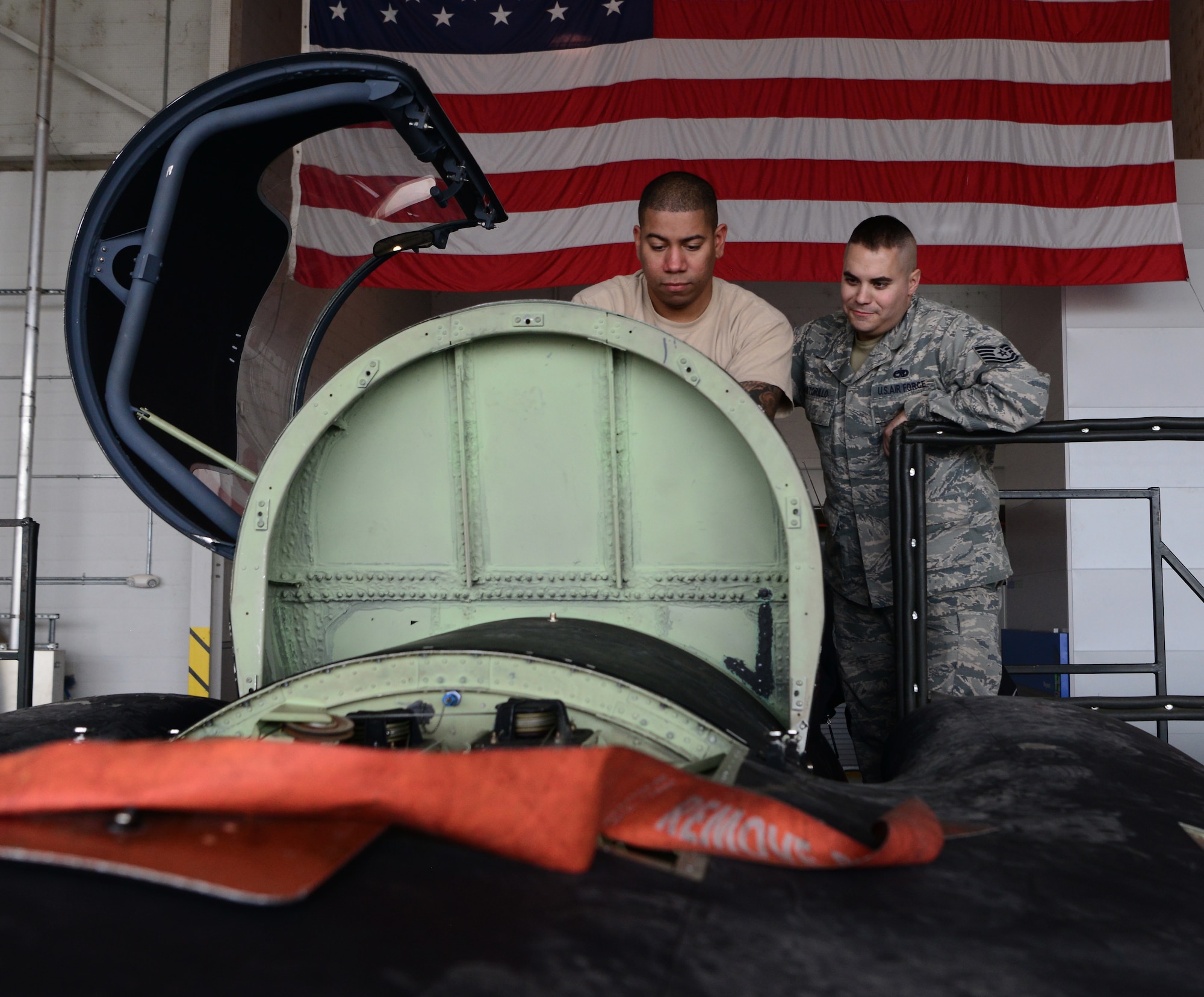 Staff Sgt. Terrance Walker and Tech. Sgt. Stephen Bartorillo, 9th Maintenance Squadron repair and reclamation craftsmen, perform phase maintenance in the cockpit of a U-2 Dragon Lady.