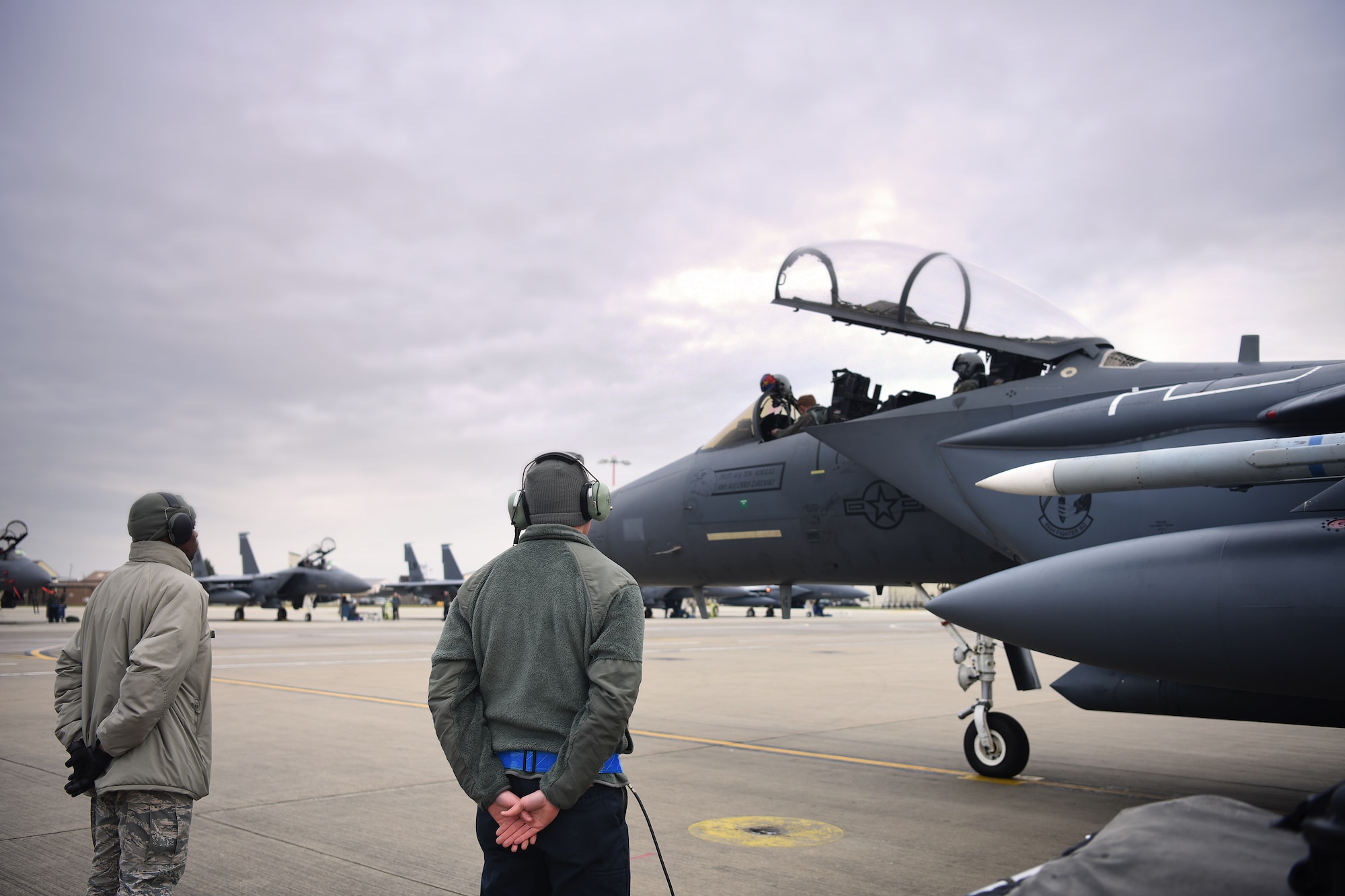 492nd Aircraft Maintenance Unit crew chiefs prepare to conduct aircraft launch procedures at Royal Air Force Lakenheath, England, Jan. 7, 2019.  492nd AMU Airmen maintain the world's premier multi-role fighter, the F-15E Strike Eagle to ensure RAF Lakenheath remains combat-ready. (U.S. Air Force photo by Airman 1st Class Shanice Williams-Jones)