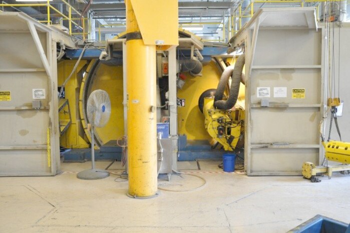 The 168-inch internal drum dynamometer, pictured, is a test machine developed and commissioned in 1998 for the purpose of aircraft tire wear testing. It operates at speeds up to 350 mph, with loads of up to 150,000 pounds, plus or minus 20 degrees of yaw, plus or minus 10 degrees of camber and can provide variable levels of brake torque. The 168i is shown here with a tire instrumented for predictive wear testing. (U.S. Air Force photo)