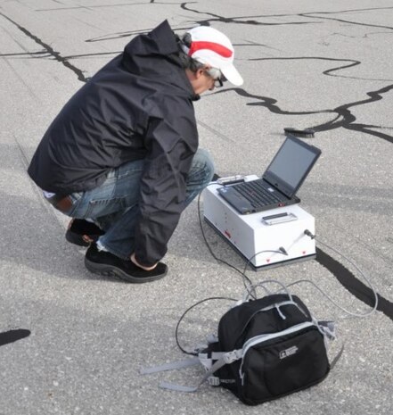 Bruce Nelson, with Battenkill Technologies, demonstrates his 3D laser carrier deck scanner on the runway at Sheppard Air Force Base, Texas.  The 704th Test Group, Aerospace Survivability and Safety Office, at Wright-Patterson Air Force Base, Ohio, has received $23,000 as part of the Squadron Innovation Funds provided by the Air Force Materiel Command. This funding is being used to further develop the unit’s 3D Runway Surface Scanning and Surface Re-Creation project at the Landing Gear Test Facility. (U.S. Air Force photo)