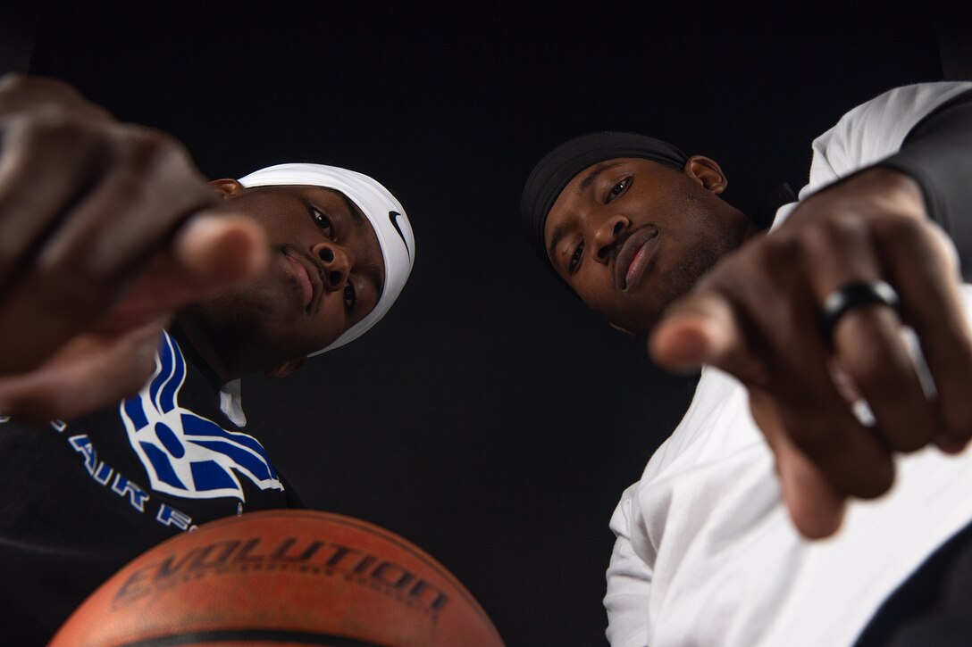 U.S. Air Force Airman 1st Class Yaquis Cole and U.S. Air Force Airman 1st Class Tyrone Cook, 377th Weapons System Security Squadron, pose for a photo at Kirtland Air Force Base, N.M., Dec 12, 2018. Cole hopes to bring a men's varsity team to Kirtland Air Force Base and eventually try-out for the Armed Forces Men's Basketball Team. (U.S. Air Force photo by Staff Sgt. J.D. Strong II)