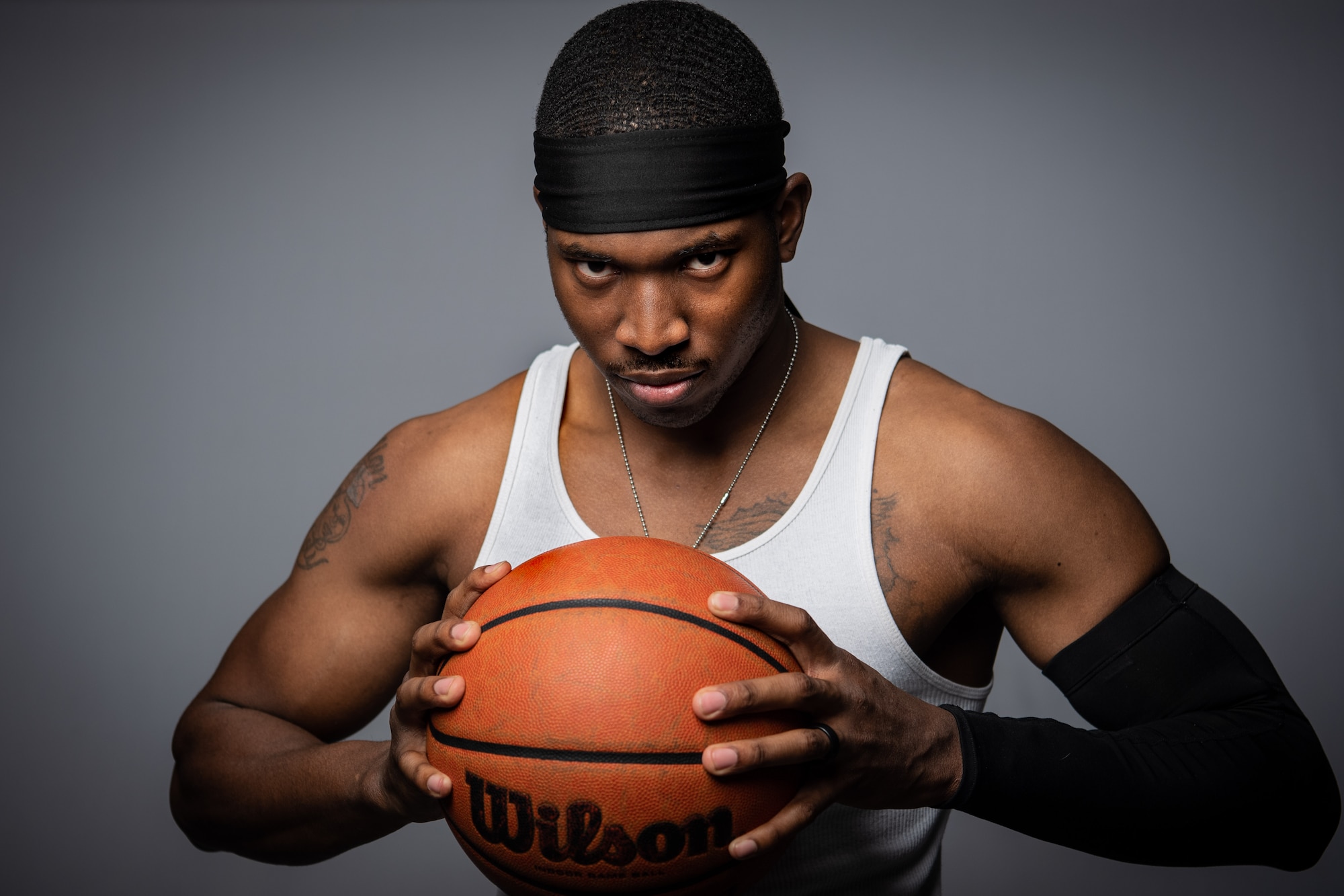 U.S. Air Force Airman 1st Class Tyrone Cook, 377th Weapons System Security Squadron, poses with a basketball for a portrait at Kirtland Air Force Base, N.M., Dec. 12, 2018. Cook is a small forward for his team and hopes to average 20 points a game this upcoming season. (U.S. Air Force photo by Airman 1st Class Austin J. Prisbrey)