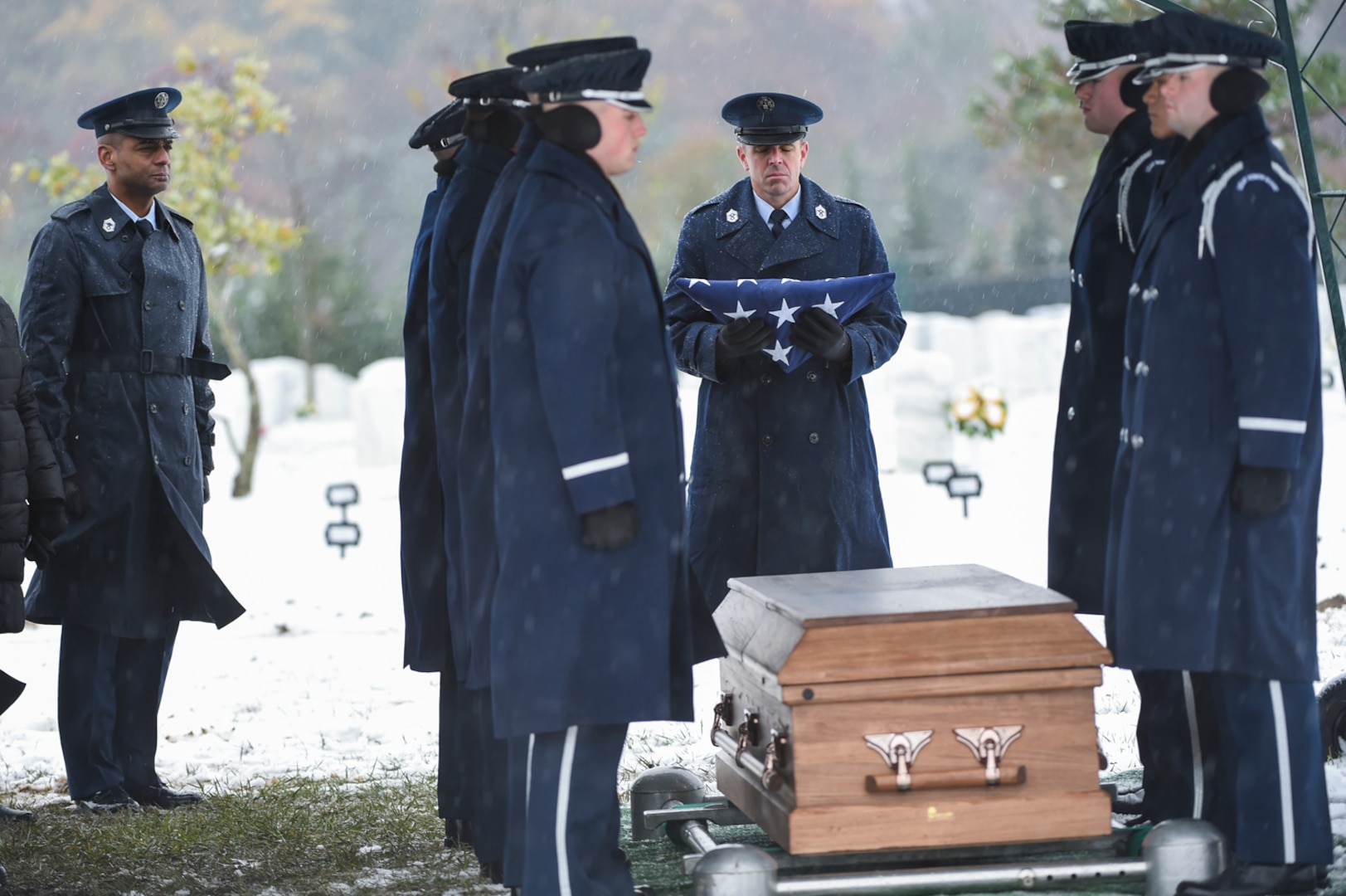 Chief Master Sgt. Benjamin Higginbotham, DIA command senior enlisted leader, holds the burial flag of Chief Master Sgt. Therese Henrion, the first female CSEL at DIA, prior to presenting it to the next of kin.