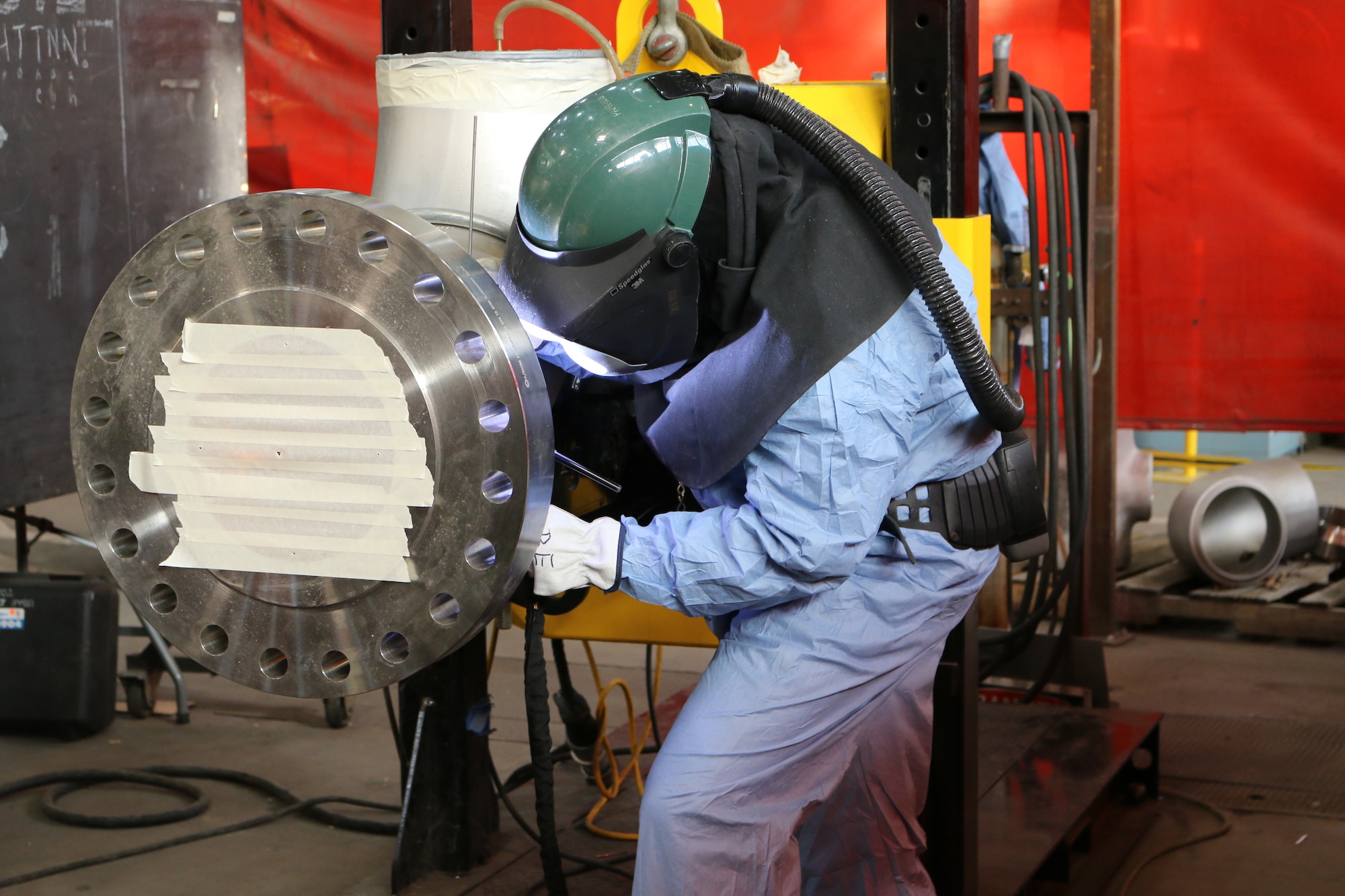 Model Shop Pipefitter Billy Joe Emberton welds a pipe in the Model and Machine Shop at Arnold Air Force Base. Craft personnel capable of welding are located in facilities and testing areas across Arnold. (U.S. Air Force photo by Bradley Hicks)