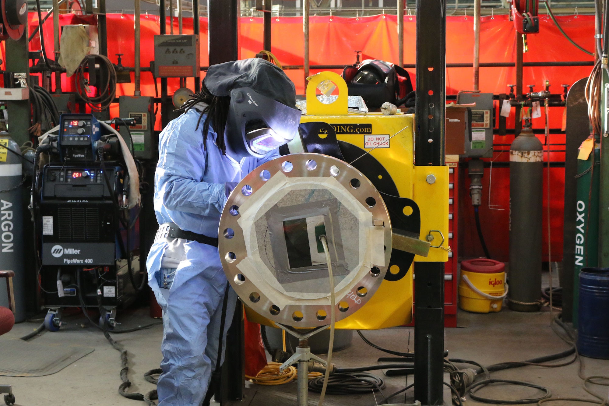 Tony Bigsby, pipefitter in the Model and Machine Shop at Arnold Air Force Base, welds a pipe for one of the test cells on base. Bigsby is one of about 40 craft workers in the Model Shop certified to perform welding. The welders support general operations at Arnold, including the repair of existing infrastructure, and testing, including the fabrication of piping for test cells. They also perform various types of welding on a variety of metals. (U.S. Air Force photo by Bradley Hicks) (This image was altered by obscuring badges for security purposes)