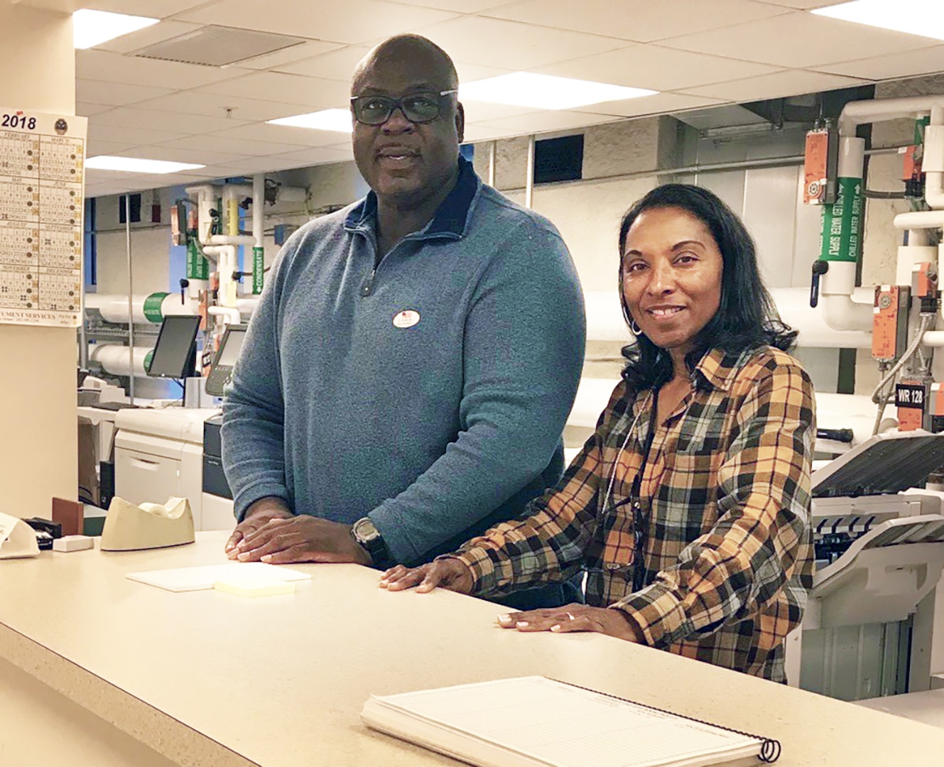DLA Executive Print Facility employees Jackie Brown and Mischelle O’Neal work the counter at the White House printing complex in Washington, D.C.