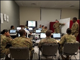 FORT KNOX, Ky. Soldiers from the Casualty Operations Division from the 14th Human Resources Sustainment Center (HRSC) reviews the casualty reporting flow. The 14th Human Resources Sustainment Center conducted a staff exchange (STAFFEX) at the Fort Knox Mission Control Training Center (MCTC) Dec 10-14.