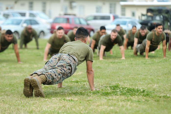 Cpl. Christopher J. Lopez leads exercises with Marines and Sailors of Combat Logistics Regiment 3, 3rd Marine Logistics Group, during Back in the Saddle (BITS) training Jan. 4, 2019 at Camp Foster, Okinawa, Japan. CLR-3 integrated physical training with BITS training in order to create an interactive learning experience. Lopez, a native of Charlotte, North Carolina, is a network administrator with Headquarters and Service Company, Combat Logistics Battalion 4, CLR-3. (U.S. Marine Corps photo by Lance Cpl. Armando Elizalde)