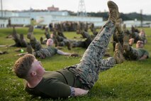 Sgt. Brandon A. Gaddy leads exercises with Marines and Sailors of Combat Logistics Regiment 3, 3rd Marine Logistics Group, during Back in the Saddle (BITS) training Jan. 4, 2019 at Camp Foster, Okinawa, Japan. CLR-3 integrated physical training with BITS training in order to create an interactive learning experience. Gaddy, a native of Fayetteville, Arkansas, is a force fitness instructor with the Correctional Custody Unit, Headquarters and Support Battalion, Marine Corps Base Camp Smedley D. Butler. (U.S. Marine Corps photo by Lance Cpl. Armando Elizalde)