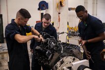 Marines with Component Repair Platoon, General Support Maintenance Company, remove parts to a Humvee engine for maintenance Jan. 8, 2019 at Camp Kinser, Okinawa, Japan. Marines with CRP, GSM Co., 3rd Maintenance Battalion, Combat Logistics Regiment 35, 3rd Marine Logistics Group, clean, rebuild and repair parts of motor vehicles to ensure that they are serviceable. (U.S. Marine Corps photo by Lance Cpl. Armando Elizalde)