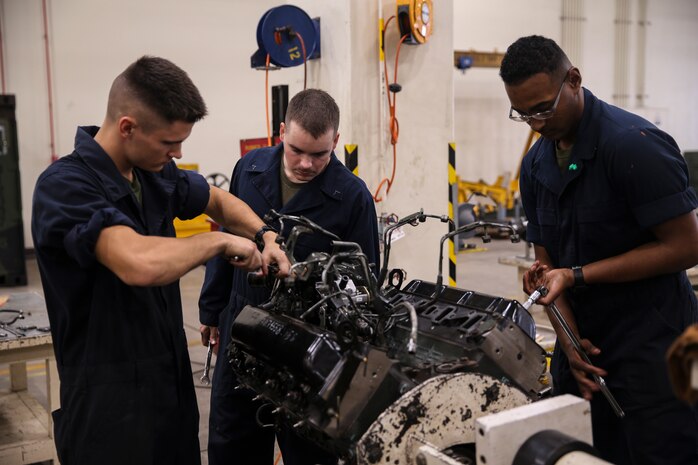 Marines with Component Repair Platoon, General Support Maintenance Company, remove parts to a Humvee engine for maintenance Jan. 8, 2019 at Camp Kinser, Okinawa, Japan. Marines with CRP, GSM Co., 3rd Maintenance Battalion, Combat Logistics Regiment 35, 3rd Marine Logistics Group, clean, rebuild and repair parts of motor vehicles to ensure that they are serviceable. (U.S. Marine Corps photo by Lance Cpl. Armando Elizalde)
