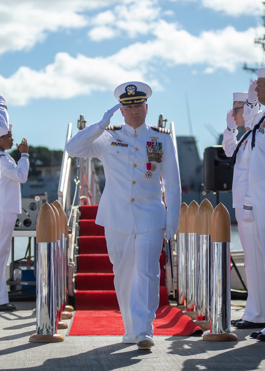 PEARL HARBOR (Jan. 08, 2019) - Capt. Richard Seif, commander of Submarine Squadron One, salutes the sideboys during a change of command ceremony on the submarine piers in Joint Base Pearl Harbor-Hickam, Jan. 08. (U.S. Navy photo by Mass Communication Specialist 2nd Class Melvin J. Gonzalvo)