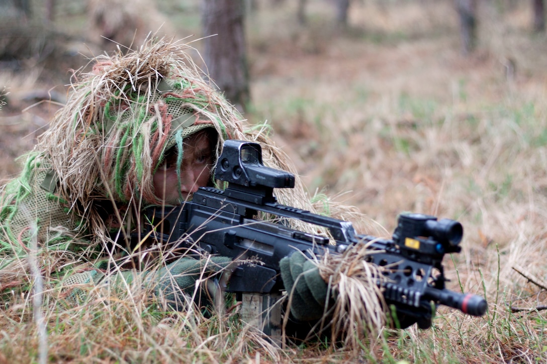 A U.S. Marine with Special Purpose Marine Air-Ground Task Force-Crisis Response-Africa provides security during a training event with German soldiers in Seedorf, Germany, Dec. 5, 2018.  This event, which focused on infantry tactics and maneuvers, marked the first time U.S. Marines have trained with German Fallschirmjäger Regiment-31. SPMAGTF-CR-AF is a rotational force deployed to conduct crisis-response and theater-security operations in Europe and Africa. (U.S. Marine Corps photo by 2nd Lt. Taylor Cox)