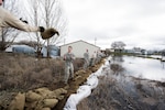 Airmen and Soldiers of the Washington National Guard assist with sandbagging during the 2017 flooding in Sprague, Wash.