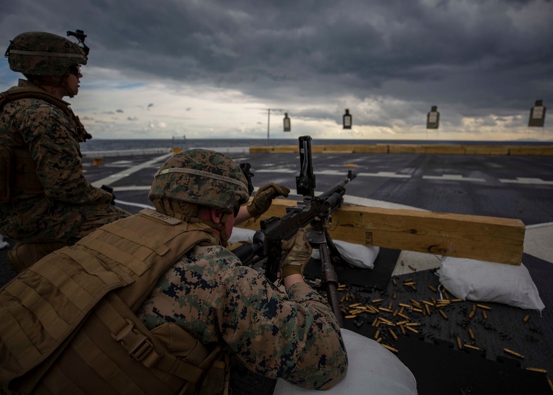 Marines with Battalion Landing Team, 1st Battalion, 2nd Marine Regiment, 22nd Marine Expeditionary Unit, fire M240B machine guns during a battle sight zeroing range on the flight deck of the USS Arlington (LPD 24) in the Mediterranean Ocean, Jan. 4, 2018. The USS Arlington is making a scheduled deployment as part of the 22nd MEU and the Kearsarge Amphibious Ready Group, in support of maritime security operations, crisis response and theatre security cooperation, while also providing a forward Naval and Marine presence.