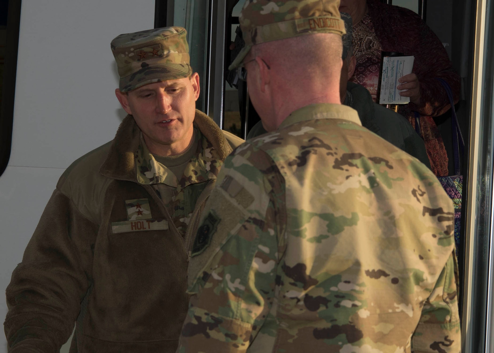 Maj. Gen. Cameron Holt, Deputy Assistant Secretary for Contracting, Office of the Assistant Secretary of the Air Force for Acquisition, Technology and Logistics, is greeted by Col. Troy L. Endicott, 460th Space Wing commander, at Buckley Air Force Base, Colo., Jan. 9, 2019. During his visit,  Holt received a mission brief met with 460th Contracting Flight Airmen.  (U.S. Air Force photo by Senior Airman Codie Collins)