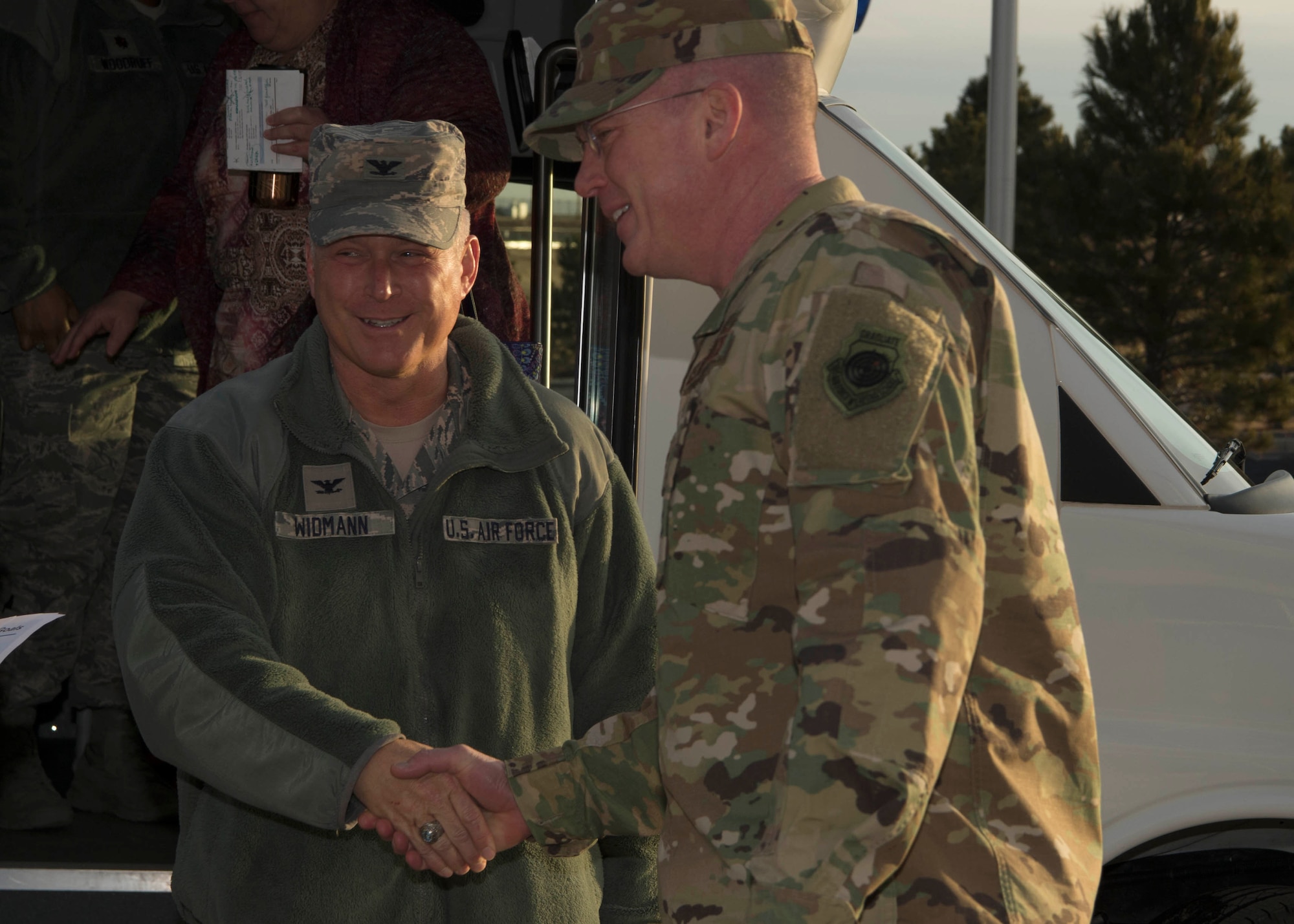 Col. Robert Widmann, Air Force Nuclear Weapons Center director of contracting, is greeted by Col. Troy L. Endicott, 460th Space Wing commander, at Buckley Air Force Base, Colo., Jan. 9, 2019. During his visit,  Widmann received a mission brief met with 460th Contracting Flight Airmen.  (U.S. Air Force photo by Senior Airman Codie Collins)