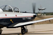 An instructor pilot and student from the 559th FTS taxi a T6 Texan II aircraft toward the runway at Joint Base San Antonio-Randolph, Texas August 19, 2009. (Photo by Joel Martinez)