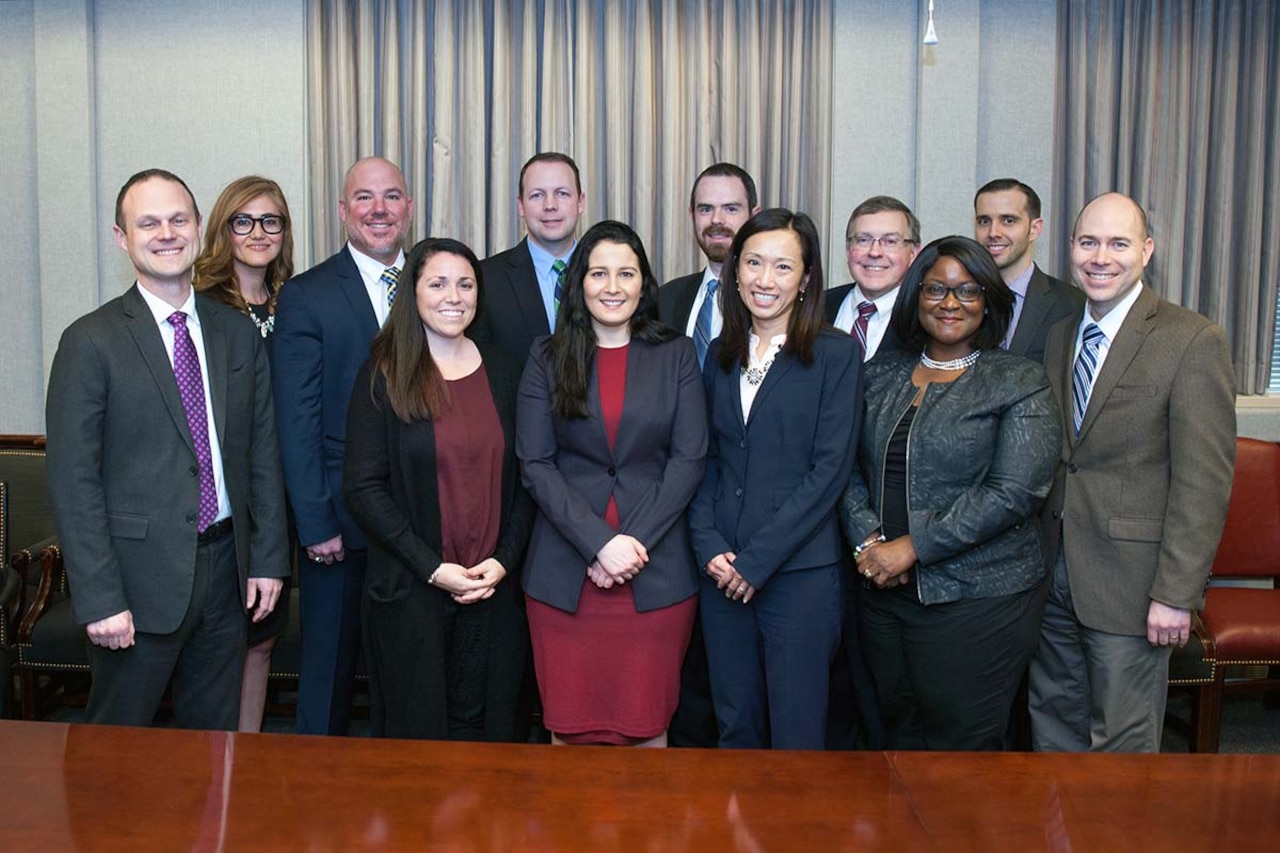 Defense-Industry Talent Exchange Program participants stand for a photo.