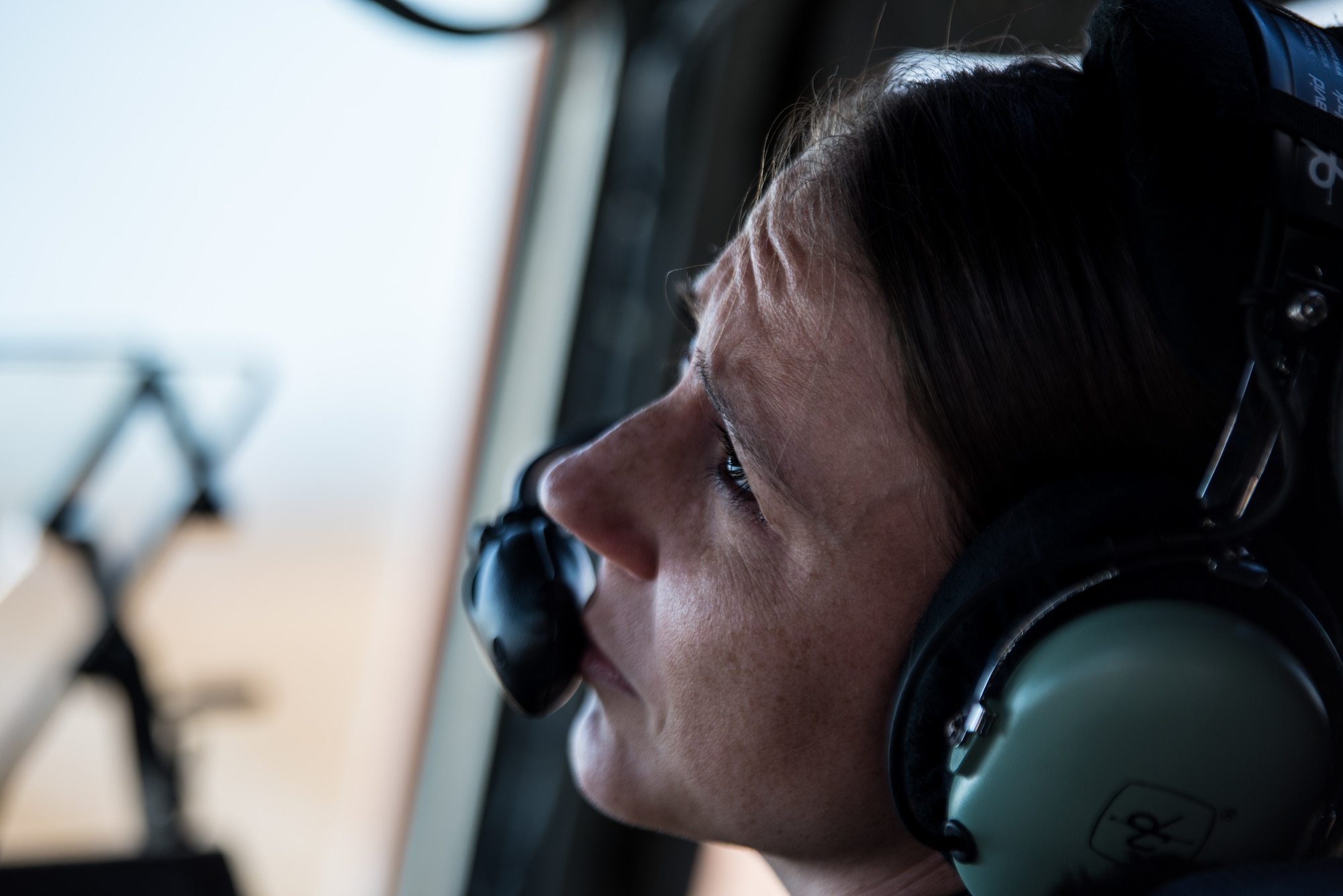 U.S. Air Force 1st Lt. Courtney Roepke, 21st Airlift Squadron C-17 Globemaster III pilot, performs pre-flight checks on a C-17 at Travis Air Force Base, Califorina, Oct. 10, 2018. The aircraft and crew departed to pick up search and rescue equipment as well as supplies to support civil authorities in Hurricane Michael relief efforts. The cargo will be delivered from Davis-Monthan AFB, Arizona to Meridian Regional Airport, Mississippi. (U.S. Air Force Photo by Master Sgt. Joseph Swafford)