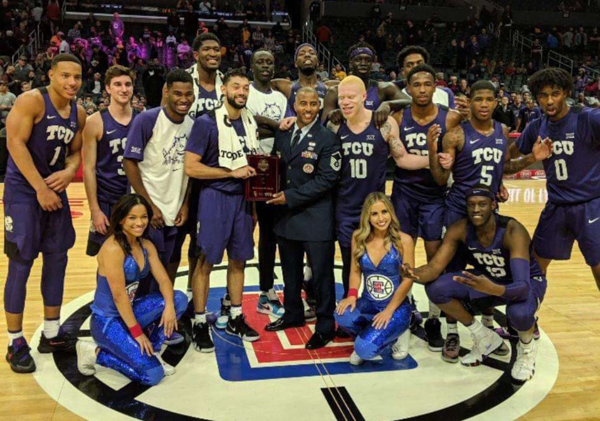 Master Sgt. Marcus Heard, a recruiter at March Air Reserve Base, poses with the championship winning TCU Horn Frogs basketball team, after they took home the Air Force Reserve Naismtih Hall of Fame Basketaball Hall of Fame Classic title in Los Angeles. Recruiters were asked to help present the MVP and championship trophies at all of the tournament AFRC sponsored. (Courtesy photo)