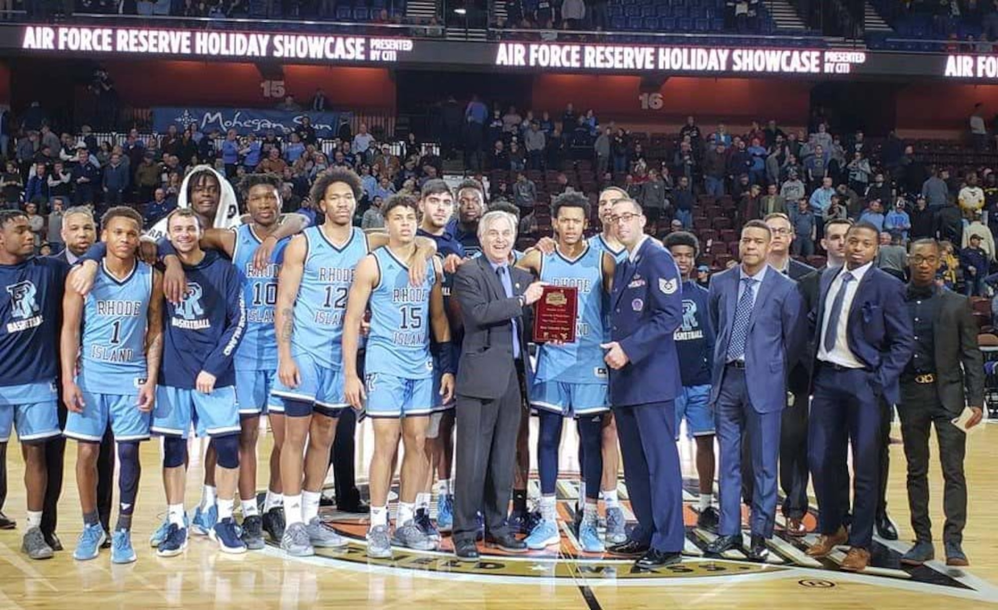 Tech. Sgt Anthony J. McCourt Jr., a recruiter from Westover Air Reserve Base, Massachusetts, presents the Rhode Island Rams with the championship trophy at the Air Force Reserve Men's Holiday Showcase at the Mohgan Sun Arena in Connecticut (Courtesy photo)