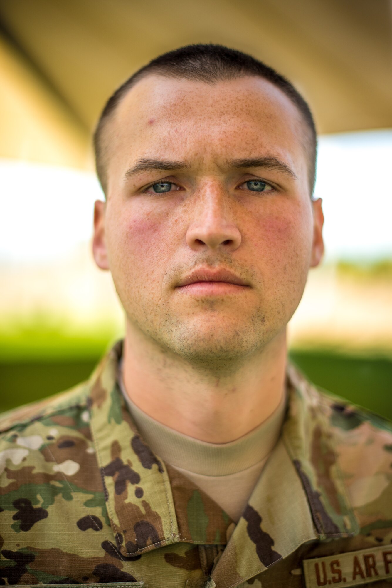 Senior Airman Zachory Boozel, 56th Security Forces Squadron military working dog handler, poses for a portrait at Luke Air Force Base, Ariz. Jan. 7, 2019. Roughly 2,300 Department of Defense canines are stationed around the world alongside their human counterparts. (U.S. Air Force photo by Senior Airman Caleb Worpel)