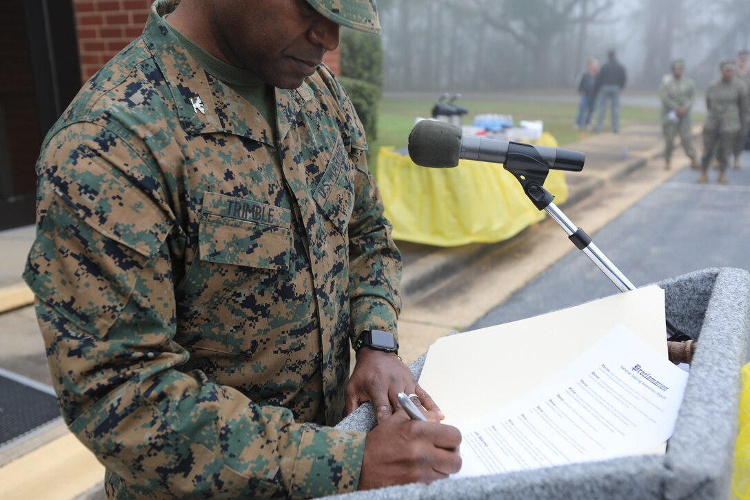 Col. Alphonso Trimble, commanding officer, Marine Corps Logistics Base Albany, signed a stalking awareness proclamation in front of Marines, civilians and several community groups at a ceremony Tuesday in front of the Base Chapel Annex.  Following the reading of the proclamation, there was a quick break and then a detailed training session inside the Chapel.