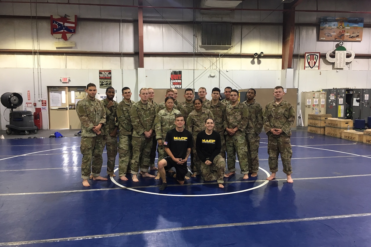 Combatives class with instructors