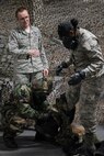 U.S. Air Force Senior Airman Richard Blackburn, 773d CES Emergency Management chemical, biological, radiological and nuclear (CBRN) instructor, teaches Airmen a new method of mission-oriented protective posture (MOPP) exchange processing during a newly-implemented chemical, biological, radiological and nuclear defense training course exercise at Joint Base Elmendorf-Richardson, Alaska, Jan. 8, 2019. One of the key changes made embraces the reintegration of hands-on, in-person instruction, and reduces computer based training, allowing Airmen to receive a more tailored learning experience. (U.S. Air Force photo by Airman 1st Class Crystal A. Jenkins)
