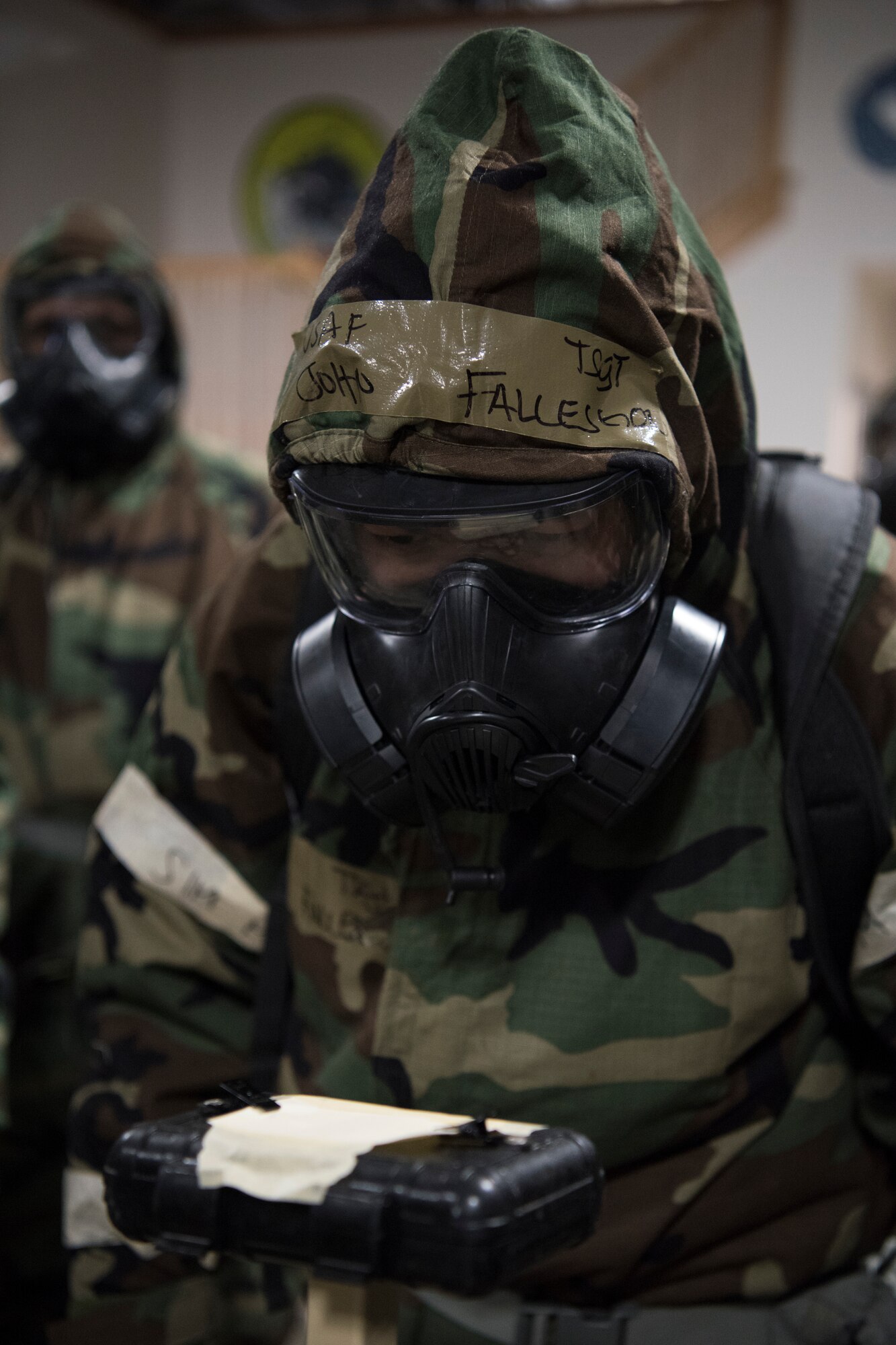 U.S. Air Force Tech. Sgt. John Fallesgon, 673d Force Support Squadron Fitness Assessment Cell noncommissioned officer in charge, evaluates M-8 paper during a newly-implemented chemical, biological, radiological and nuclear defense training course at Joint Base Elmendorf-Richardson, Alaska, Jan. 8, 2019. One of the key changes made embraces the reintegration of hands-on, in-person instruction, and reduces computer based training, allowing Airmen to receive a more tailored learning experience. (U.S. Air Force photo by Airman 1st Class Crystal A. Jenkins)