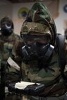 U.S. Air Force Tech. Sgt. John Fallesgon, 673d Force Support Squadron Fitness Assessment Cell noncommissioned officer in charge, evaluates M-8 paper during a newly-implemented chemical, biological, radiological and nuclear defense training course at Joint Base Elmendorf-Richardson, Alaska, Jan. 8, 2019. One of the key changes made embraces the reintegration of hands-on, in-person instruction, and reduces computer based training, allowing Airmen to receive a more tailored learning experience. (U.S. Air Force photo by Airman 1st Class Crystal A. Jenkins)