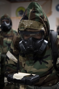 U.S. Air Force Tech. Sgt. John Fallesgon, 673d Force Support Squadron Fitness Assessment Cell noncommissioned officer in charge, evaluates M-8 paper during a newly-implemented chemical, biological, radiological and nuclear defense training course at Joint Base Elmendorf-Richardson, Alaska, Jan. 8, 2019. One of the key changes made embraces the reintegration of hands-on, in-person instruction, and reduces computer based training, allowing Airmen to receive a more tailored learning experience. (U.S. Air Force photo by Airman 1st Class Crystal A. Jenkins)
