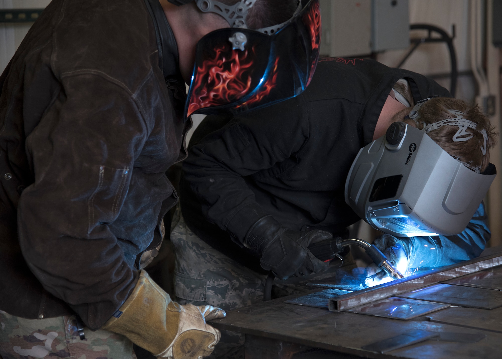 Tech. Sgt. Dustin Lockhart, 635th Material Maintenance Squadron metals technologist, supervises Airman 1st Class Cody Sisk, 635th Material Maintenance Squadron metals technologist, Jan. 9. 2019, on Holloman Air Force Base, N.M. Lockhart is optimistic about the future and takes pride in building up his mental fitness to not only help himself, but help others. (U.S. Air Force photo by Airman 1st Class Kindra Stewart)