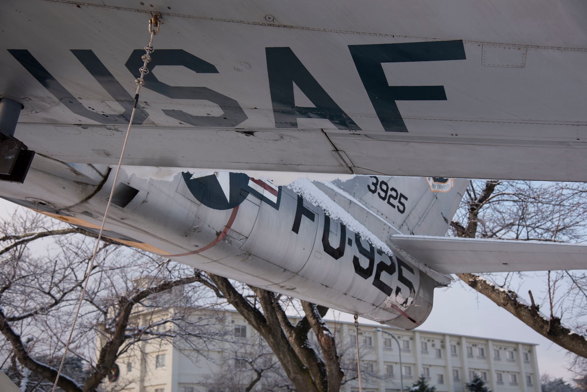 An F-86F Sabre displays its tail number and a "USAF" marking in Risner Circle at Misawa Air Base, Japan, Dec. 18, 2018. The aircraft could climb 6,000 ft per minute and reached a maximum speed of 690 mph. The model began production in 1952, and both U.S. Air Force and Japan Air Self-Defense Force units at Misawa AB utilized the aircraft until 1979, downing 818 MIGs during the Korean War. (U.S. Air Force photo)
